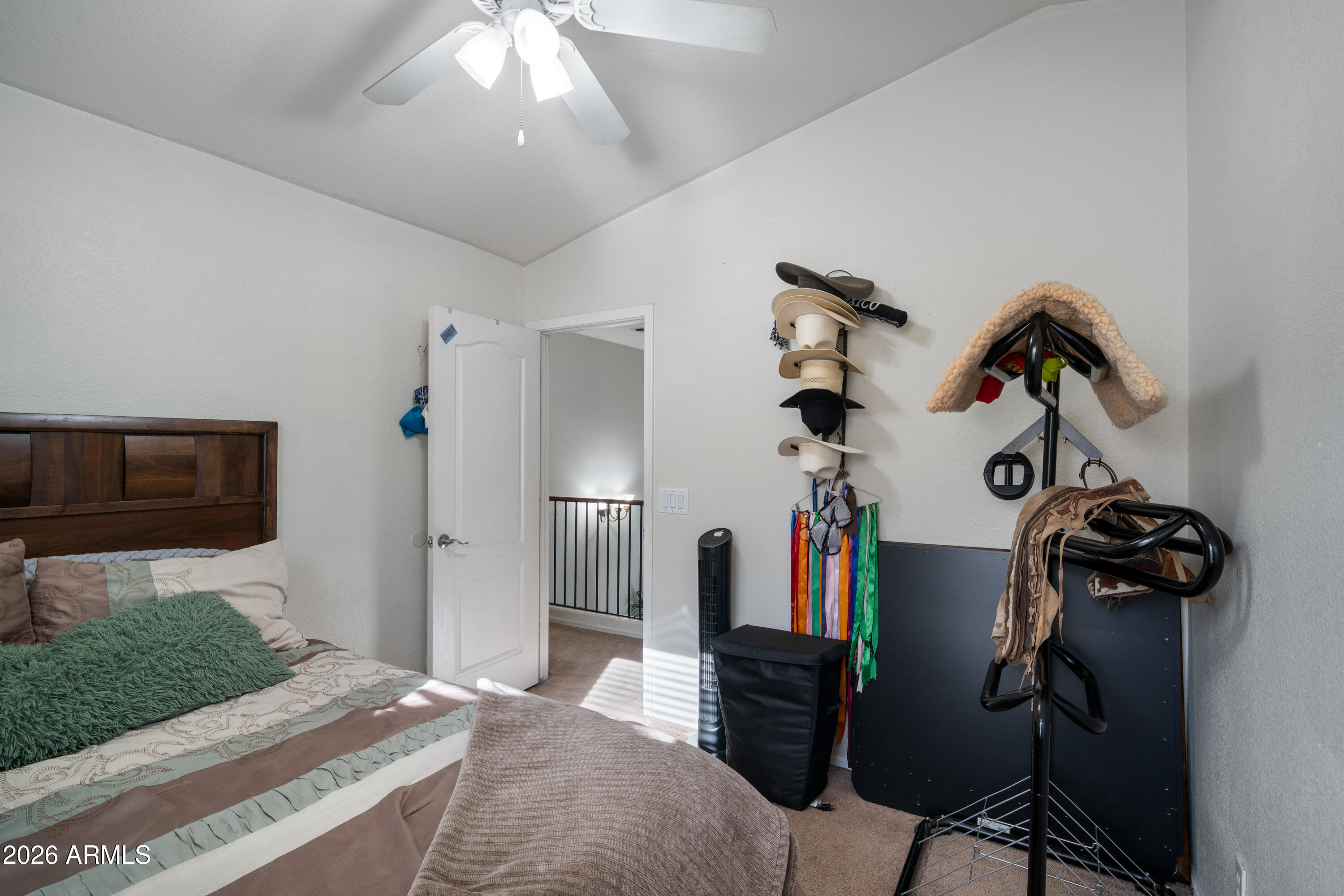 16221 West Latham Street Goodyear, AZ 85338 - Photo 24 of 30 a bedroom with a bed and wooden floor