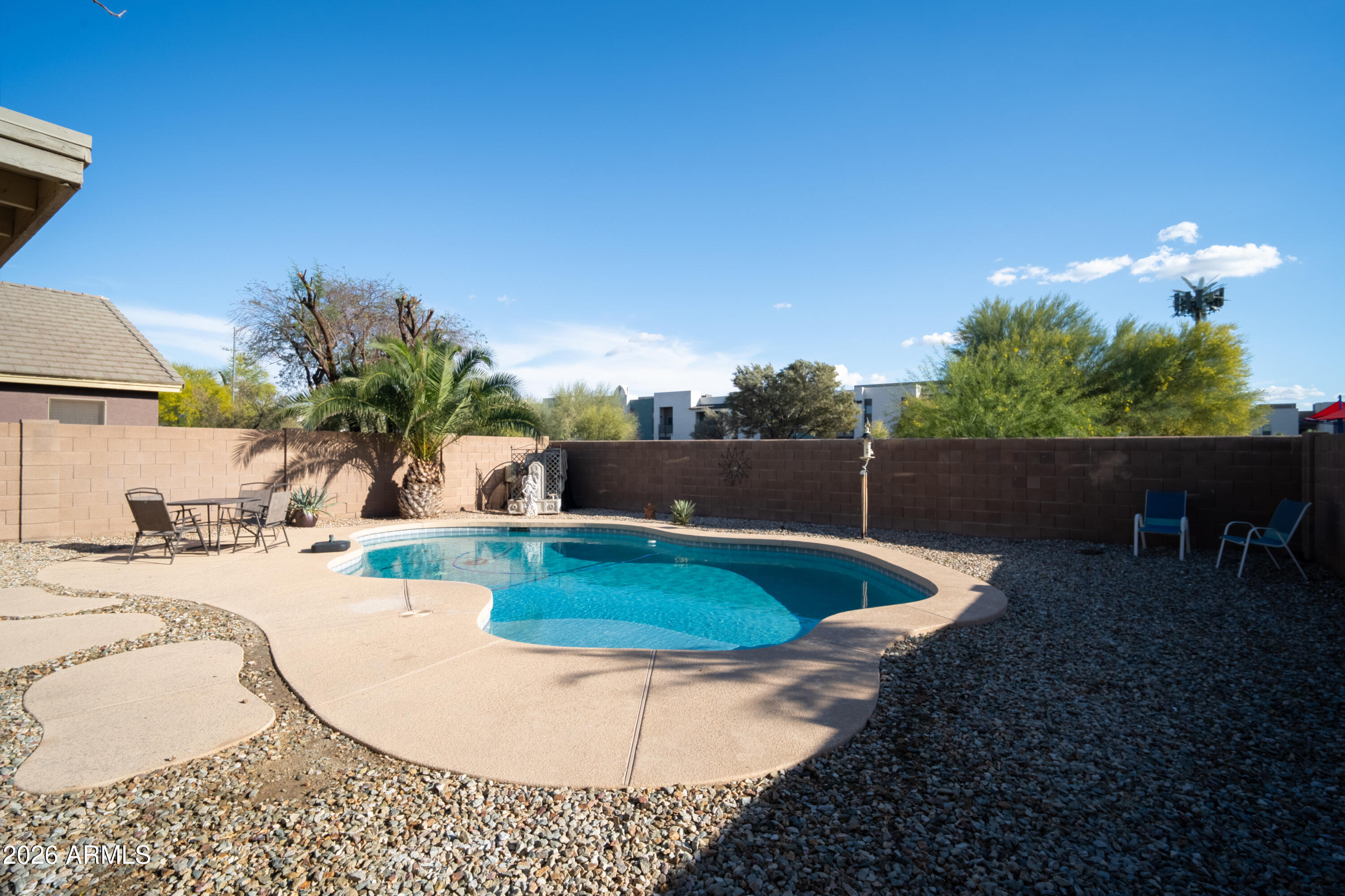 16221 West Latham Street Goodyear, AZ 85338 - Photo 26 of 30 a view of a backyard with plants and patio