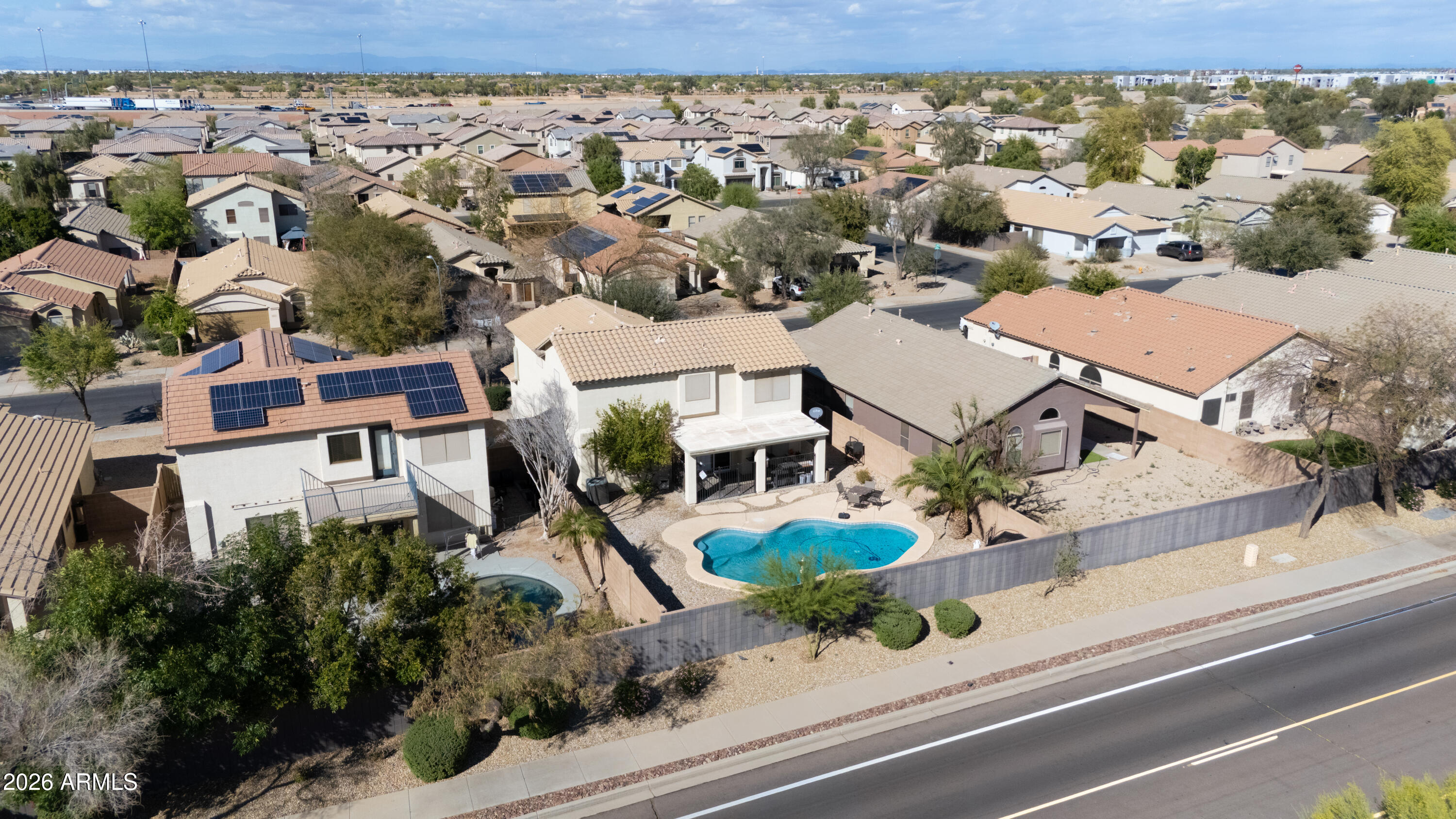 16221 West Latham Street Goodyear, AZ 85338 - Photo 28 of 30 an aerial view of residential houses with outdoor space