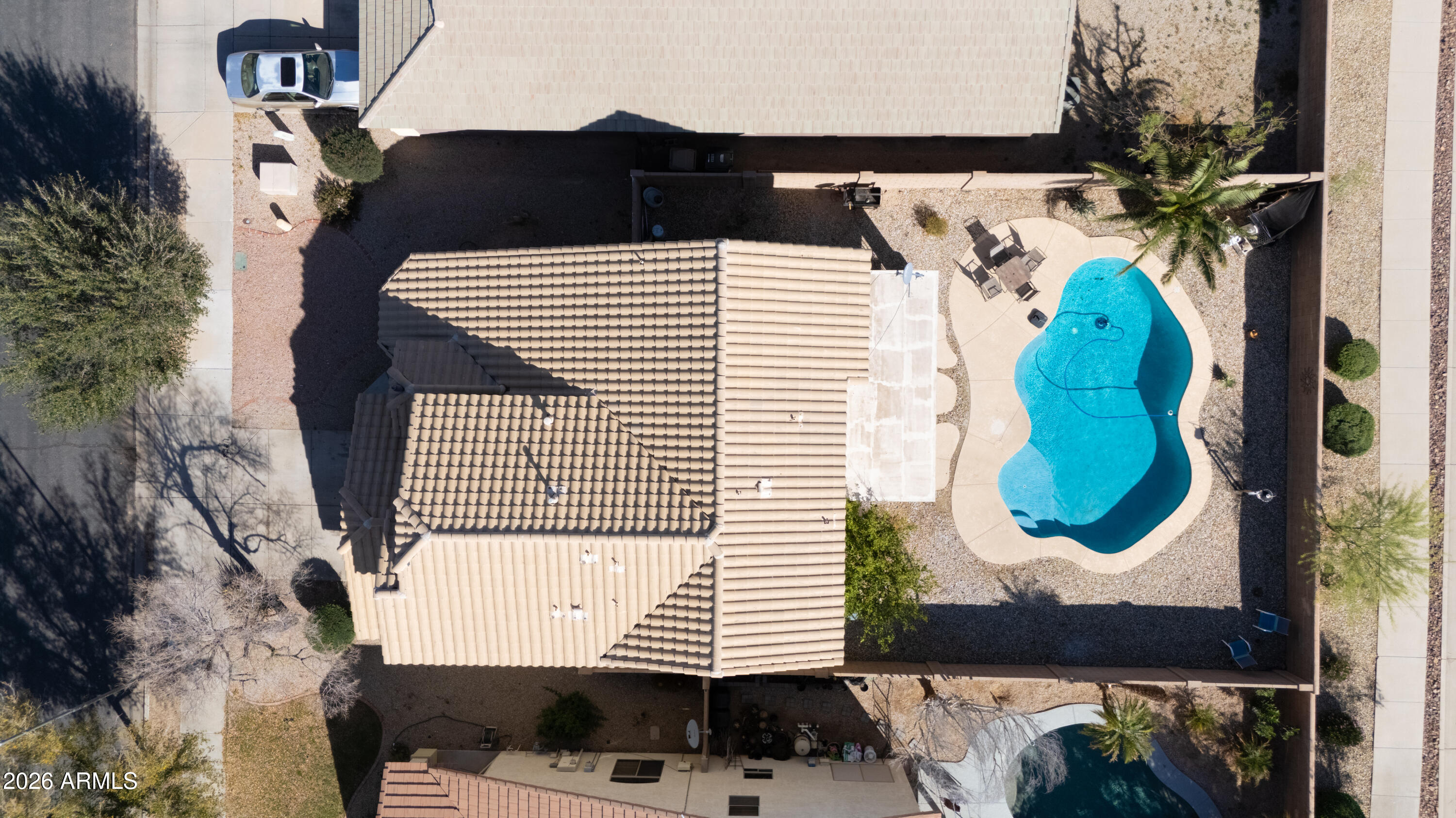 16221 West Latham Street Goodyear, AZ 85338 - Photo 29 of 30 an aerial view of a house with a yard and potted plants
