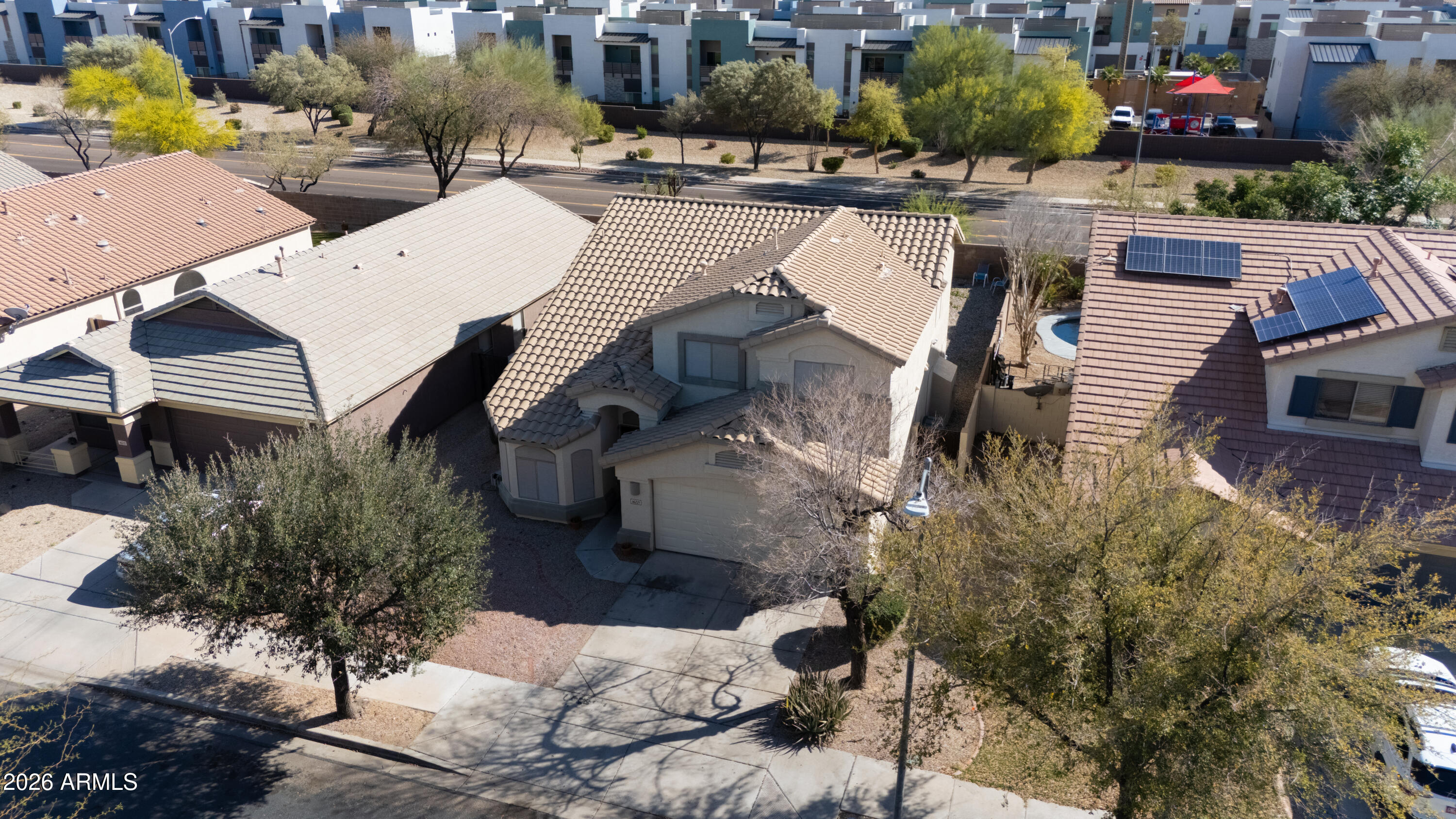 16221 West Latham Street Goodyear, AZ 85338 - Photo 30 of 30 a view of a house with pool and sitting area