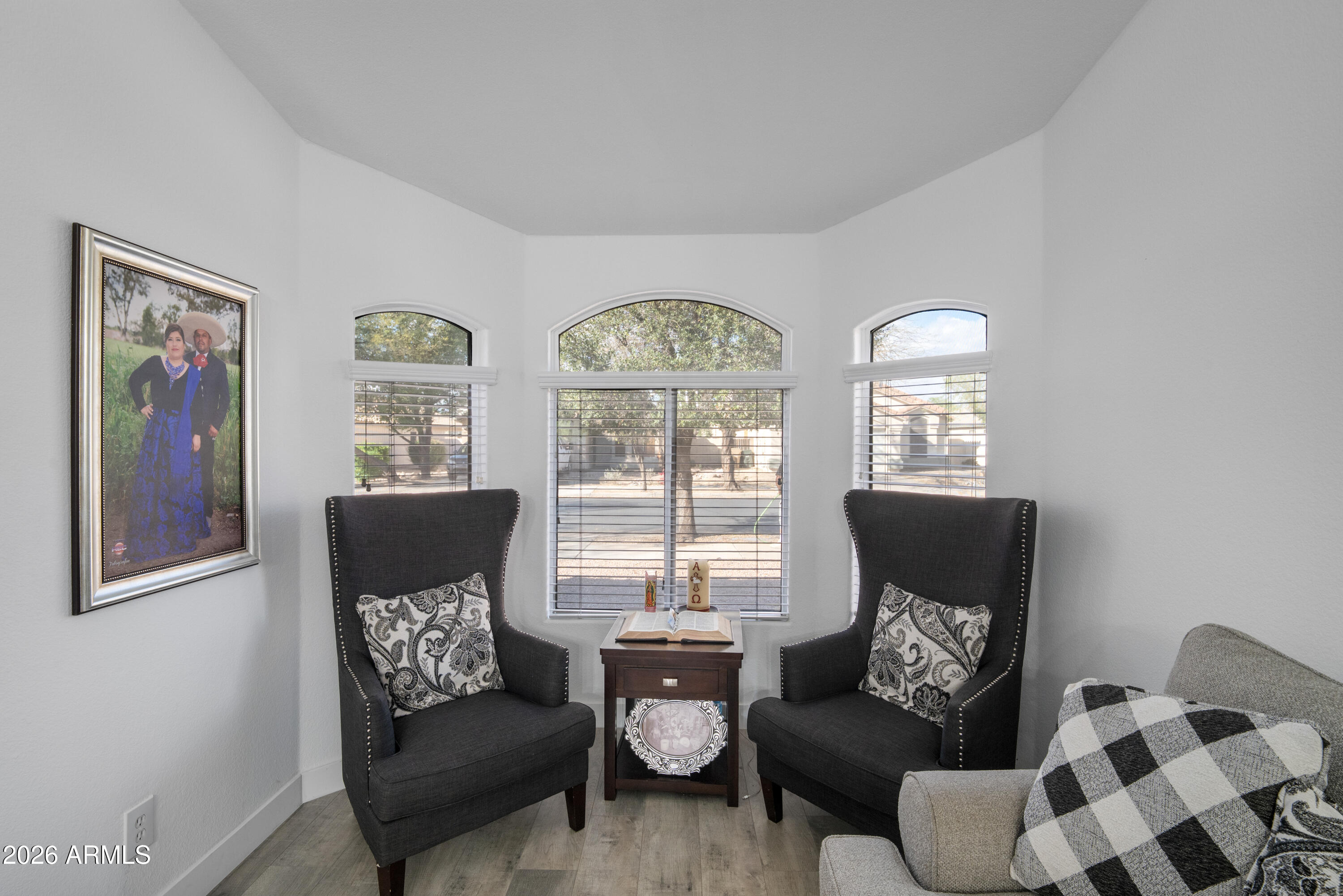 16221 West Latham Street Goodyear, AZ 85338 - Photo 6 of 30 a living room with furniture and a large window