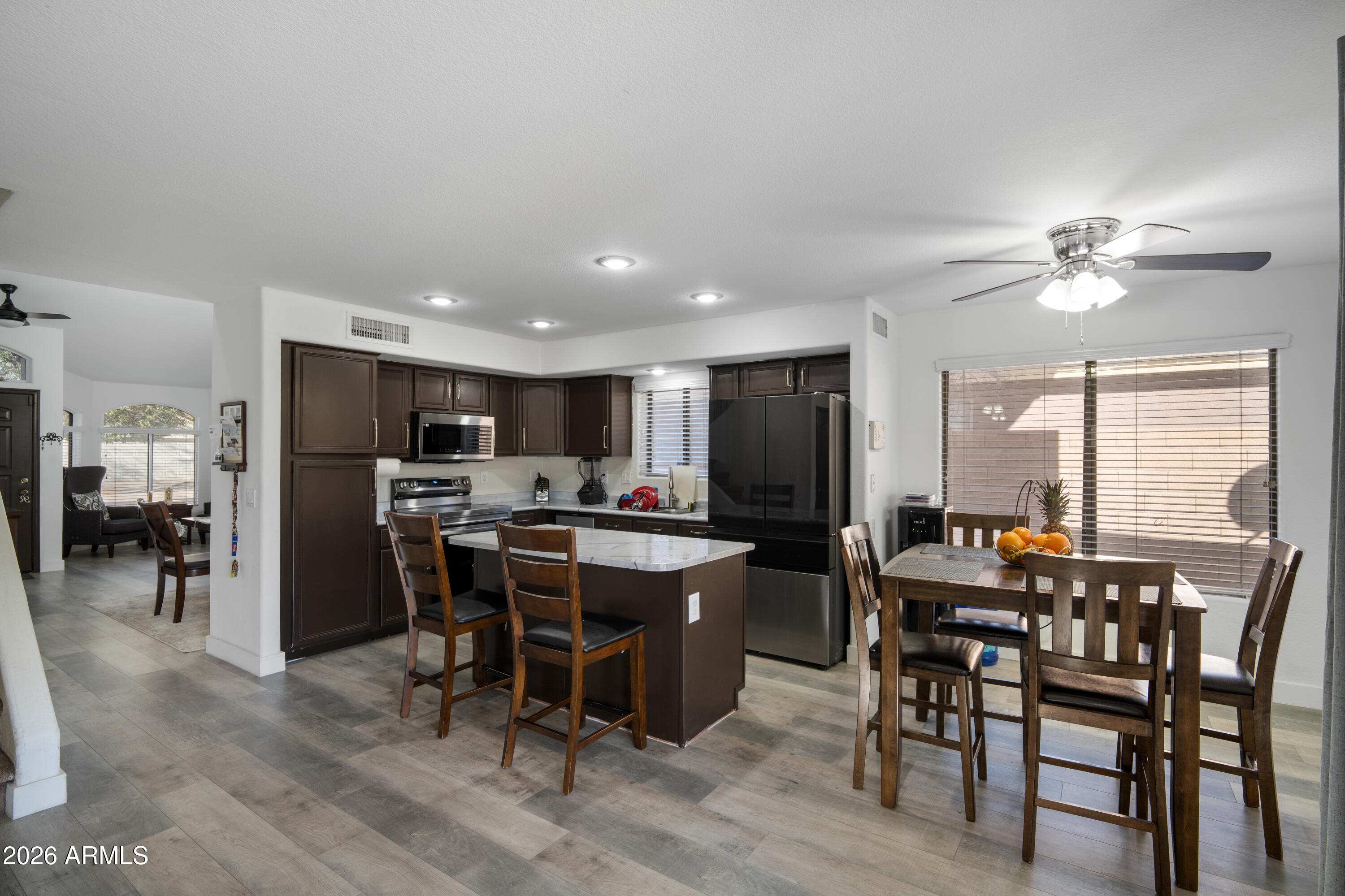 16221 West Latham Street Goodyear, AZ 85338 - Photo 7 of 30 a view of a dining room with furniture