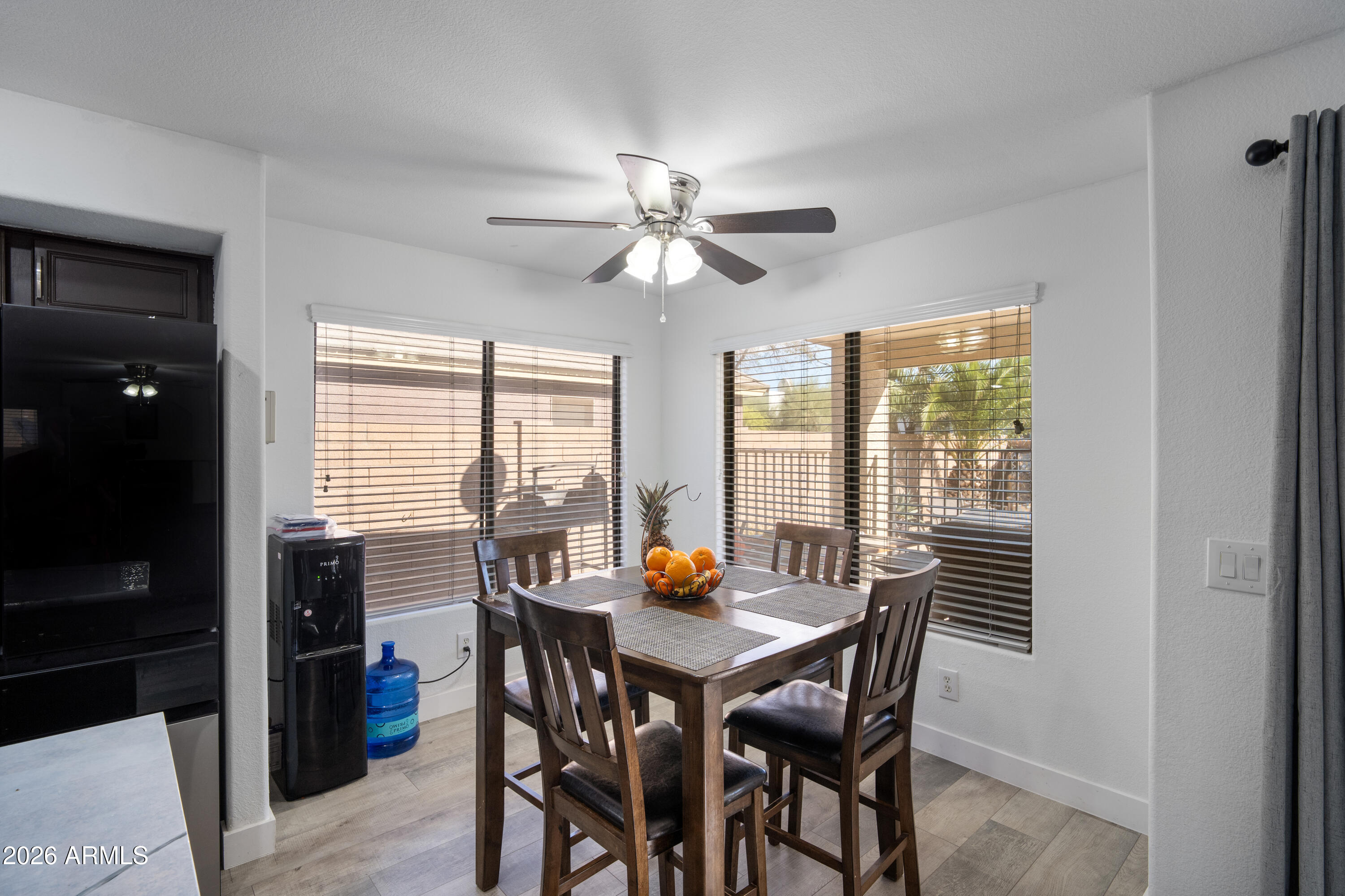 16221 West Latham Street Goodyear, AZ 85338 - Photo 8 of 30 a view of a dining room with furniture window and outside view