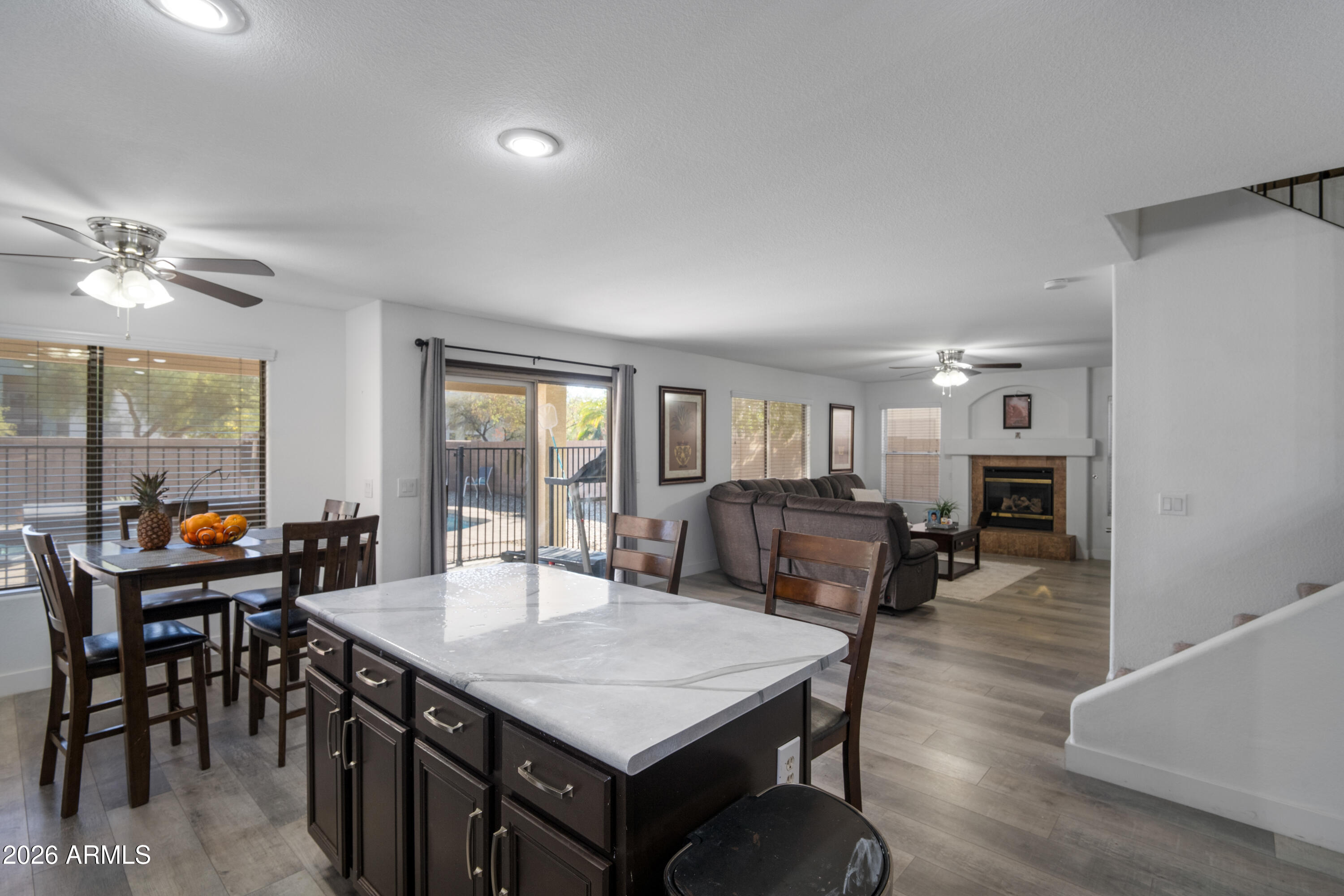 16221 West Latham Street Goodyear, AZ 85338 - Photo 10 of 30 a view of a dining room with furniture and a livingroom