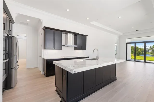a kitchen with a sink and a refrigerator