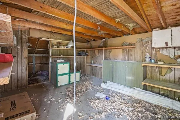 a view of a room with wooden walls