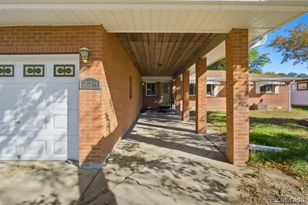 a view of a brick house with many windows