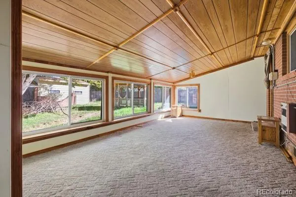 a view of a room with large windows