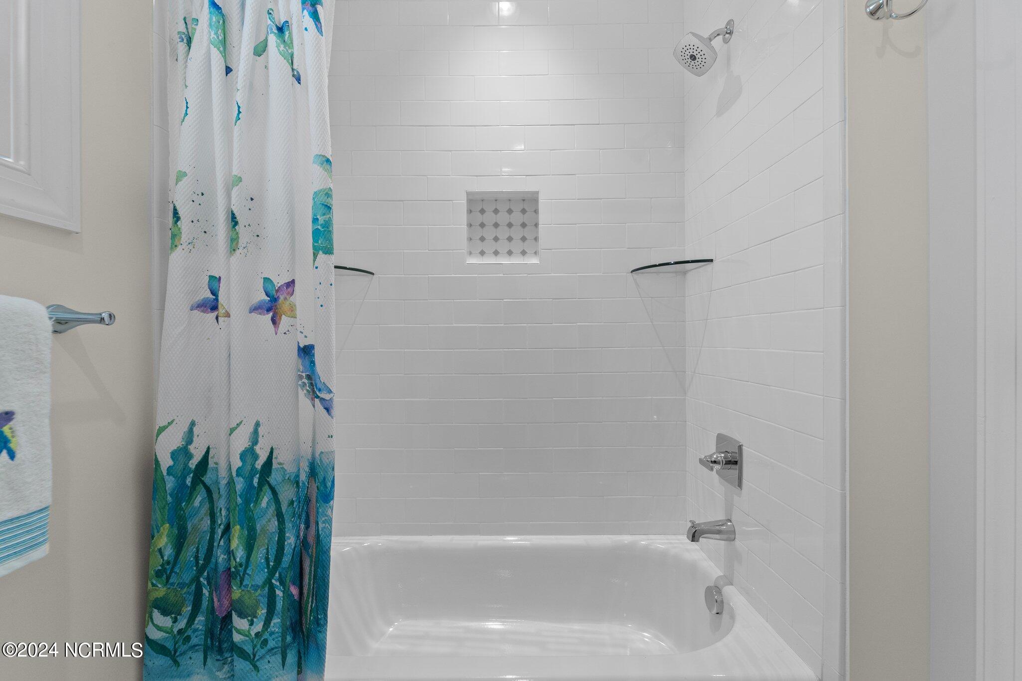 2 Buckhorn Road Jackson Springs, NC 27281 - Photo 25 of 56 Tub/shower with tile surround, niche & glass corner shelving
