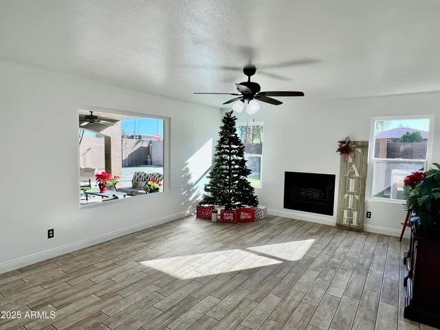 a bed sitting in a bedroom next to a lamp