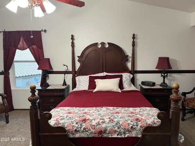 a bathroom with a sink a toilet and shower curtain