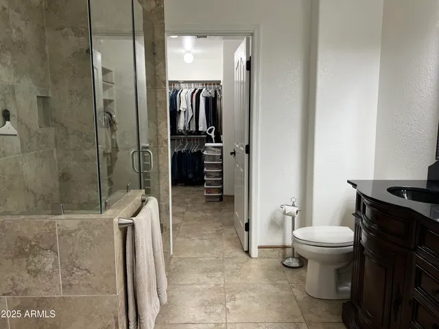 a view of a porch with furniture and garden