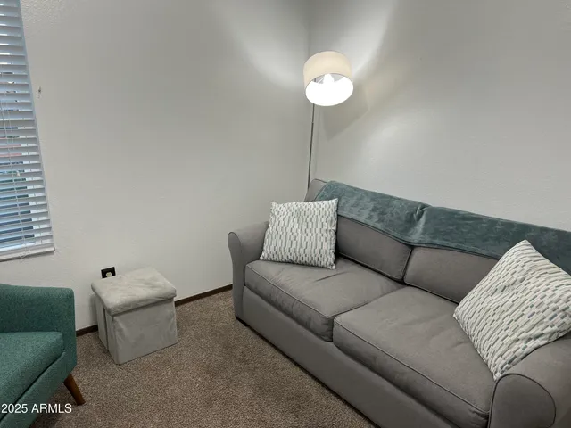 a house view with a sitting space and garden