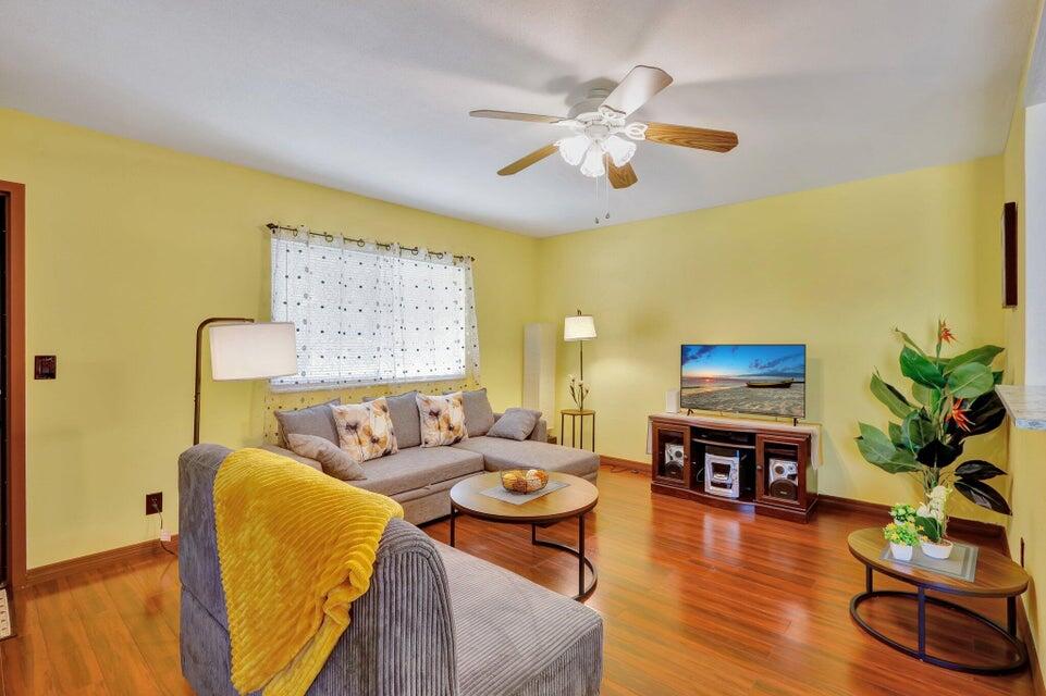 278 Monaco Way, Unit F Delray Beach, FL 33446 - Photo 5 of 19 a living room with furniture and wooden floor