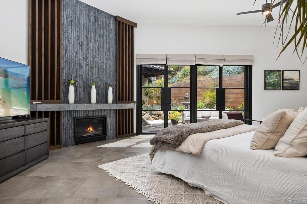 1240 Berryman Canyon Encinitas, CA 92024 - Photo 21 of 64 a bed sitting in a bedroom next to a window