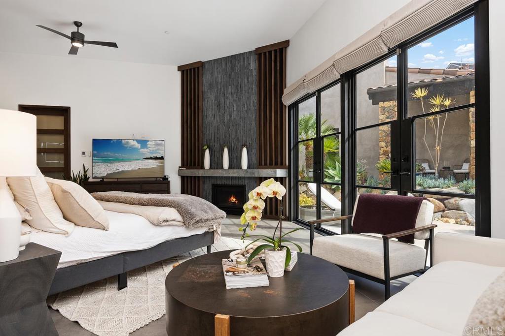 1240 Berryman Canyon Encinitas, CA 92024 - Photo 22 of 64 a living room with furniture and a floor to ceiling window