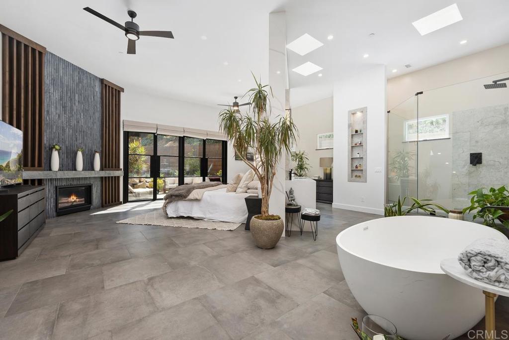 1240 Berryman Canyon Encinitas, CA 92024 - Photo 23 of 64 a living room with furniture a chandelier and a large window