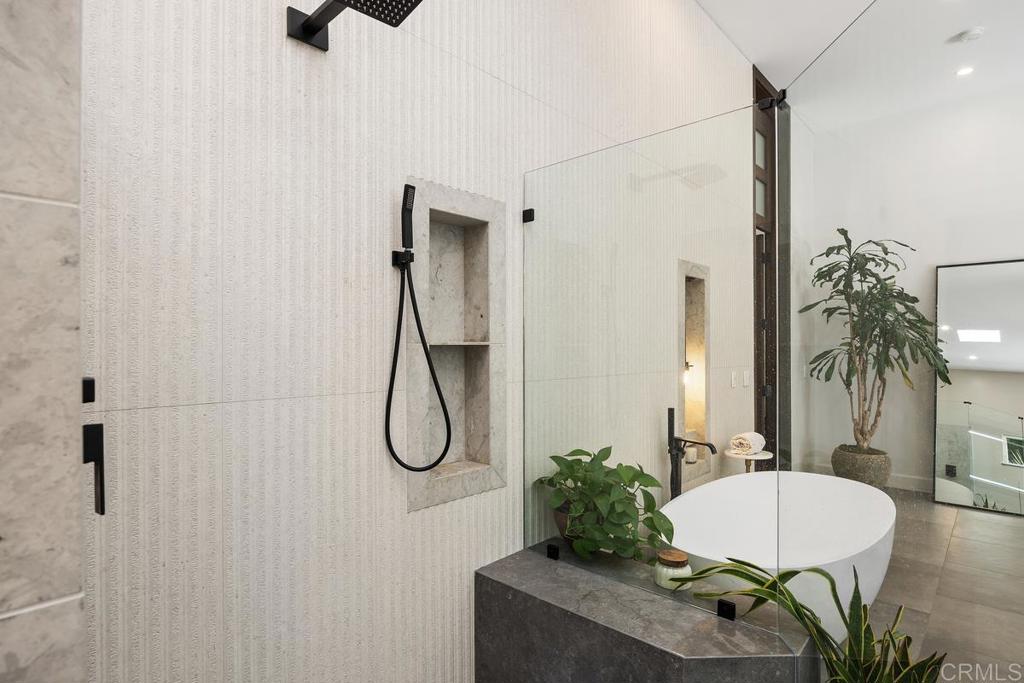 1240 Berryman Canyon Encinitas, CA 92024 - Photo 27 of 64 a bathroom with a granite countertop sink a mirror and shower