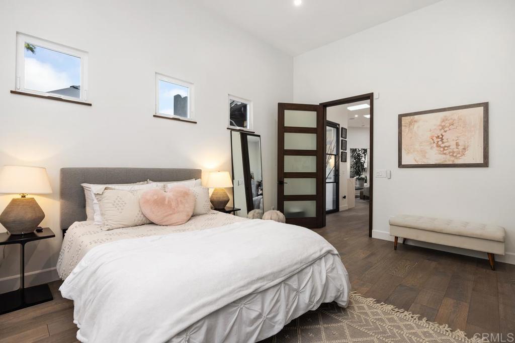 1240 Berryman Canyon Encinitas, CA 92024 - Photo 29 of 64 a spacious bedroom with a bed and a cabinets