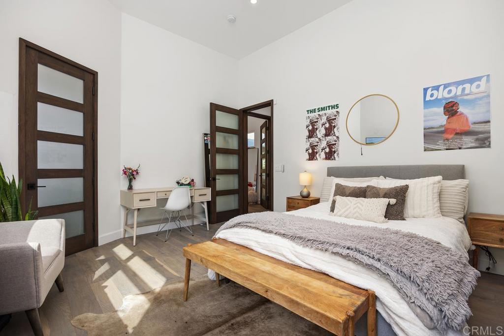 1240 Berryman Canyon Encinitas, CA 92024 - Photo 32 of 64 a bedroom with bed and a chair