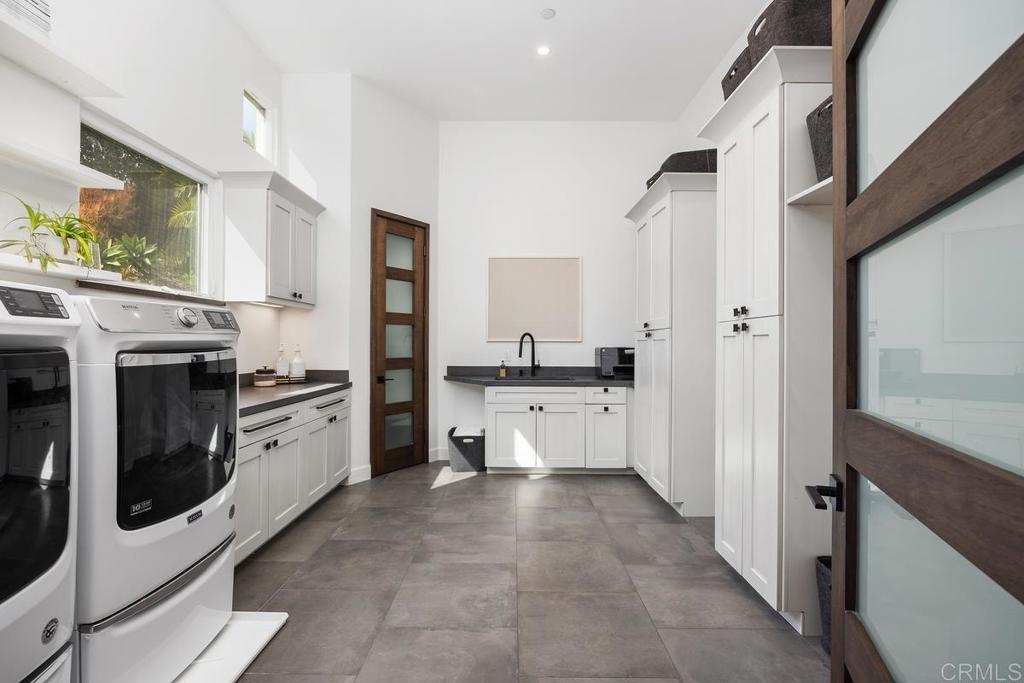 1240 Berryman Canyon Encinitas, CA 92024 - Photo 35 of 64 a kitchen with stainless steel appliances a stove a refrigerator and cabinets