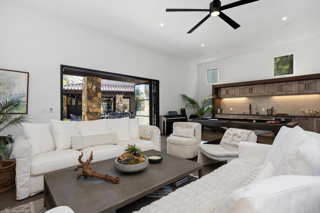 1240 Berryman Canyon Encinitas, CA 92024 - Photo 37 of 64 a living room with furniture and a flat screen tv