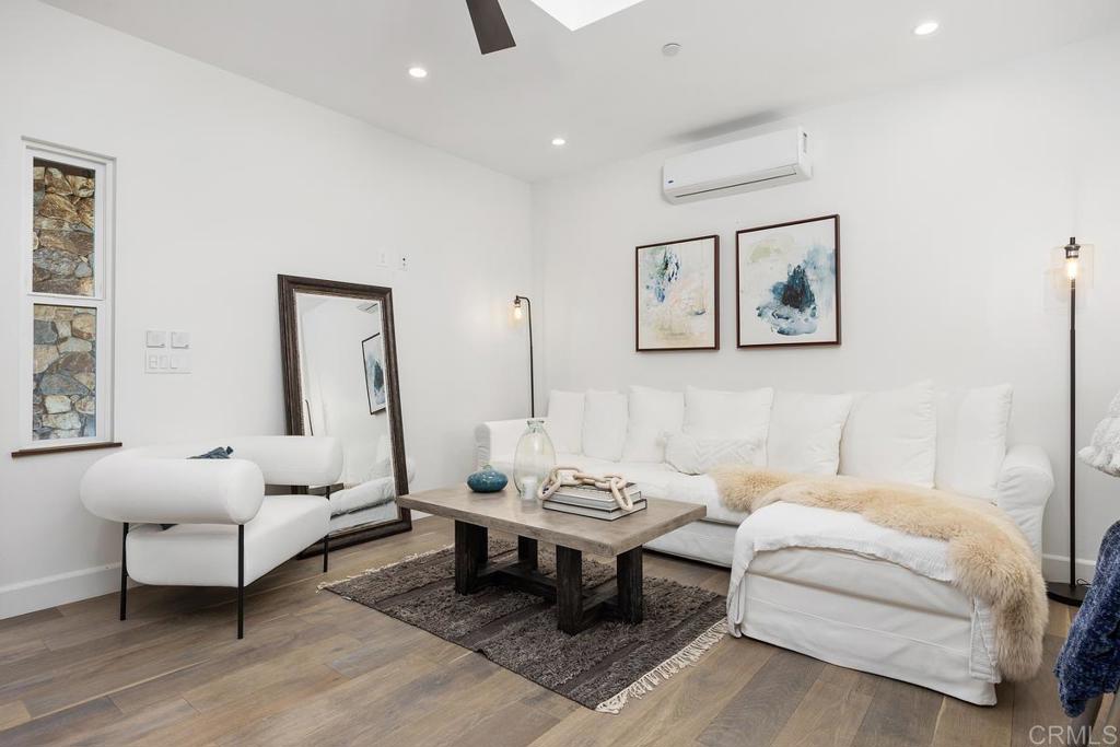 1240 Berryman Canyon Encinitas, CA 92024 - Photo 43 of 64 a living room with furniture and wooden floor