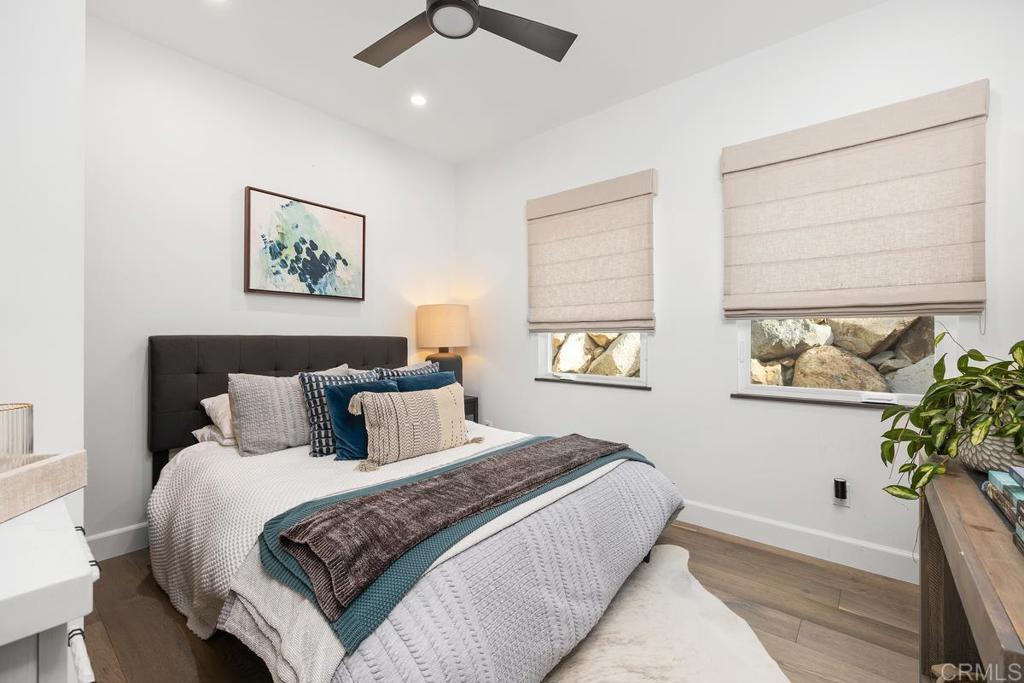 1240 Berryman Canyon Encinitas, CA 92024 - Photo 44 of 64 a bedroom with bed and a potted plant