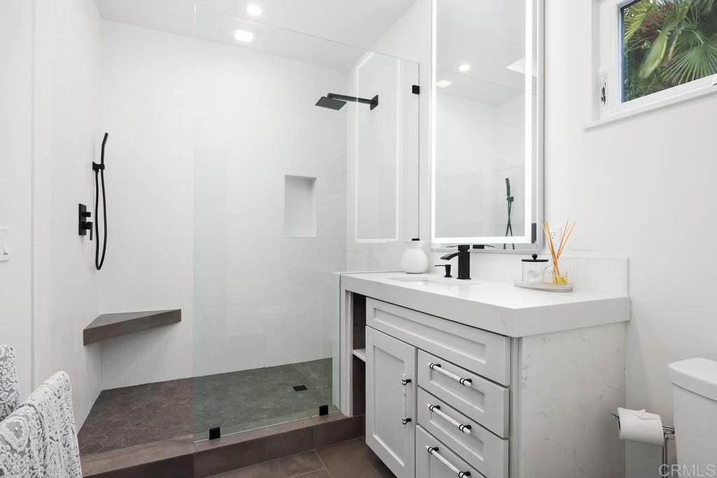 1240 Berryman Canyon Encinitas, CA 92024 - Photo 46 of 64 a bathroom with a sink a toilet and a mirror