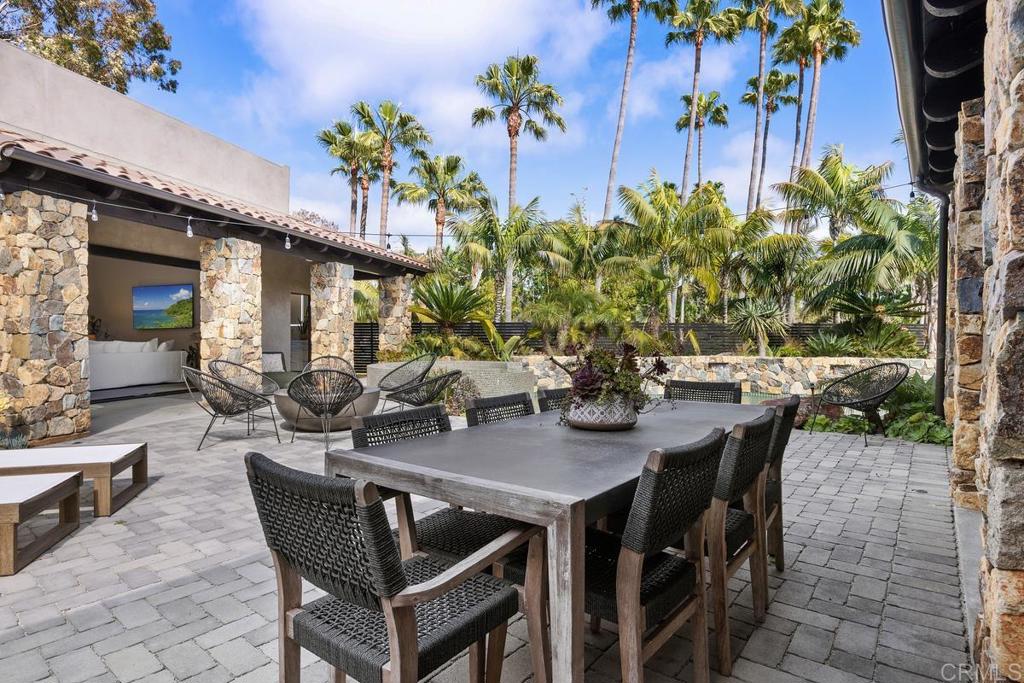 1240 Berryman Canyon Encinitas, CA 92024 - Photo 52 of 64 a view of a dining room with furniture and a potted plant
