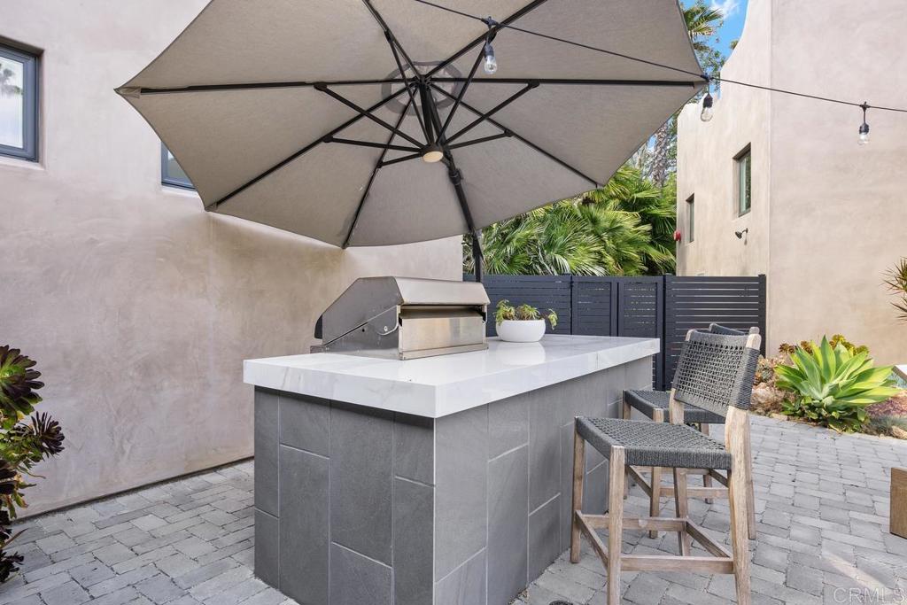 1240 Berryman Canyon Encinitas, CA 92024 - Photo 53 of 64 a table and chairs in patio of a house