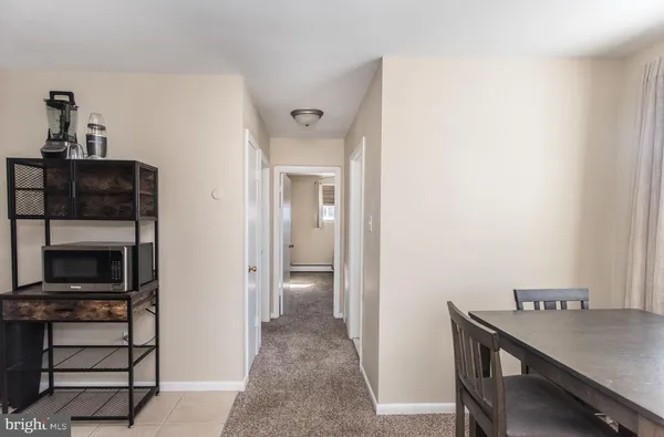 a view of room with furniture and wooden floor
