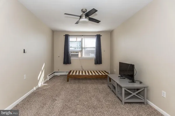 a view of a room with workspace and windows