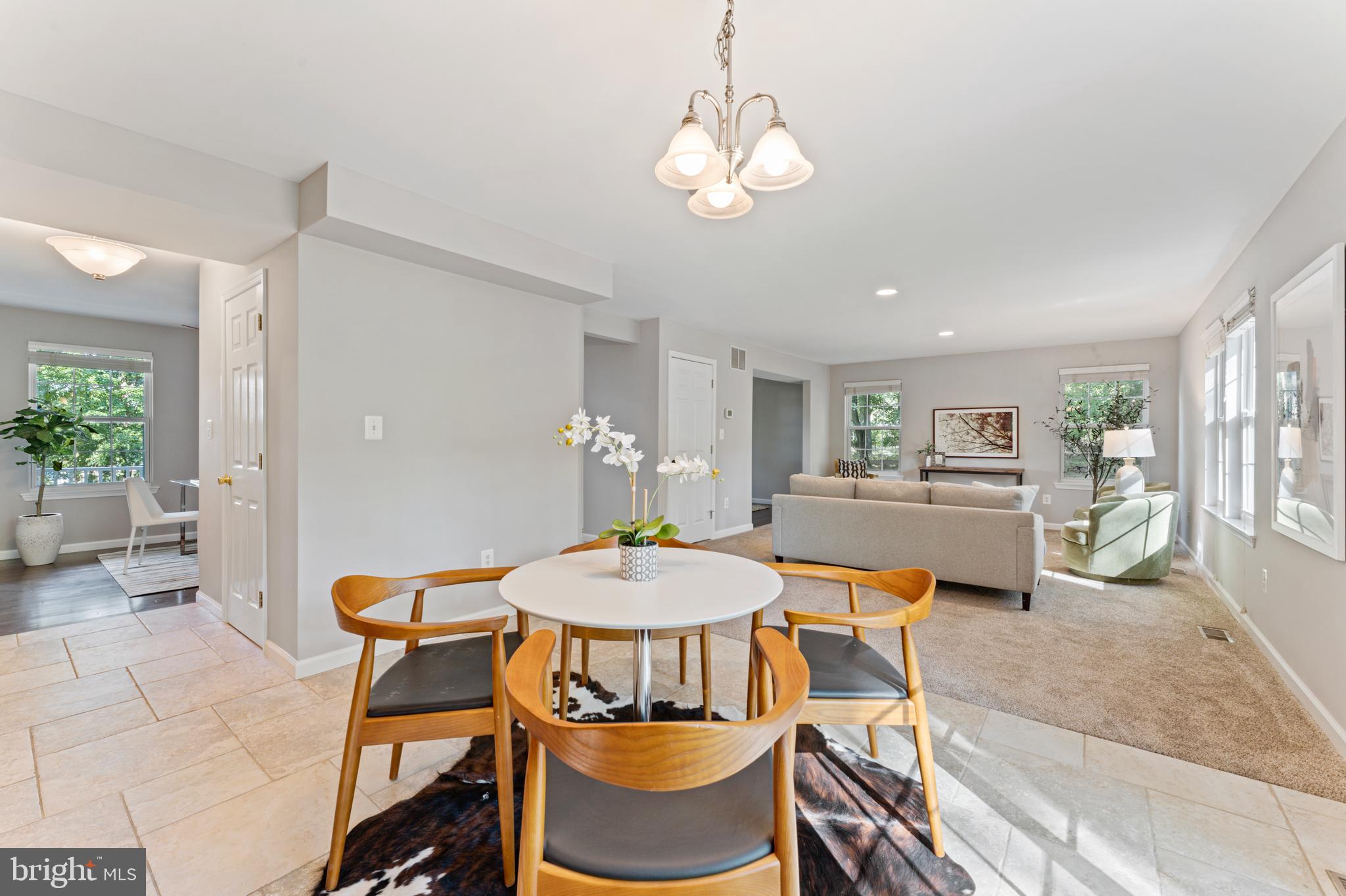 1555 Wall Drive Pasadena, MD 21122 - Photo 14 of 46 a view of a dining room with furniture and a chandelier