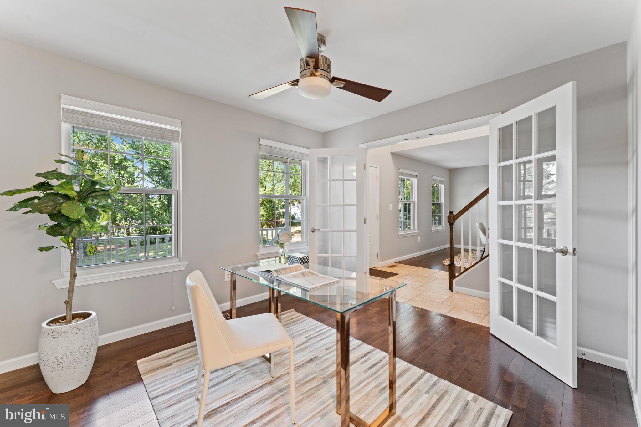 1555 Wall Drive Pasadena, MD 21122 - Photo 15 of 46 a workspace with wooden floor and a potted plant