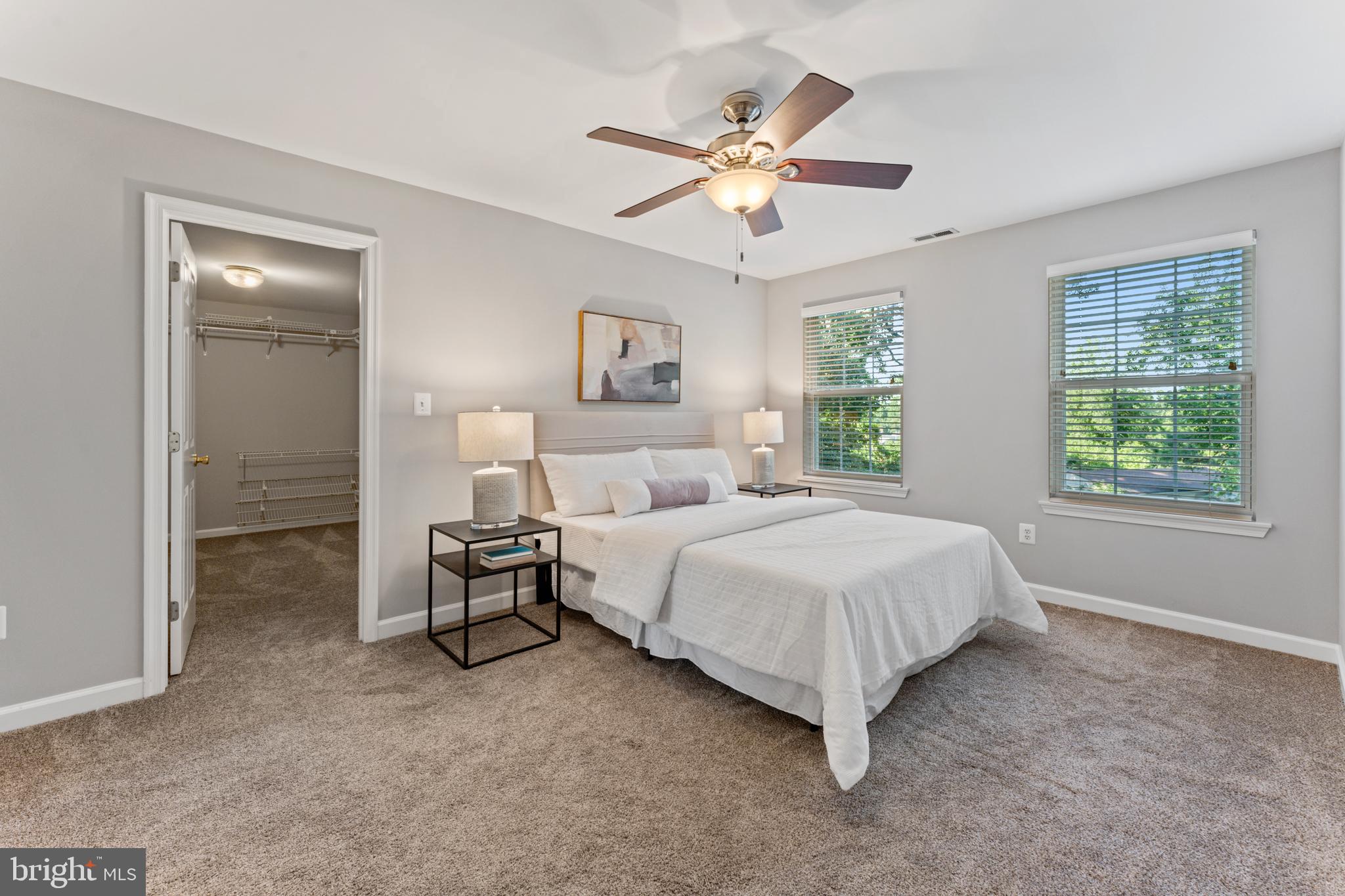 1555 Wall Drive Pasadena, MD 21122 - Photo 20 of 46 a spacious bedroom with a bed and a chandelier