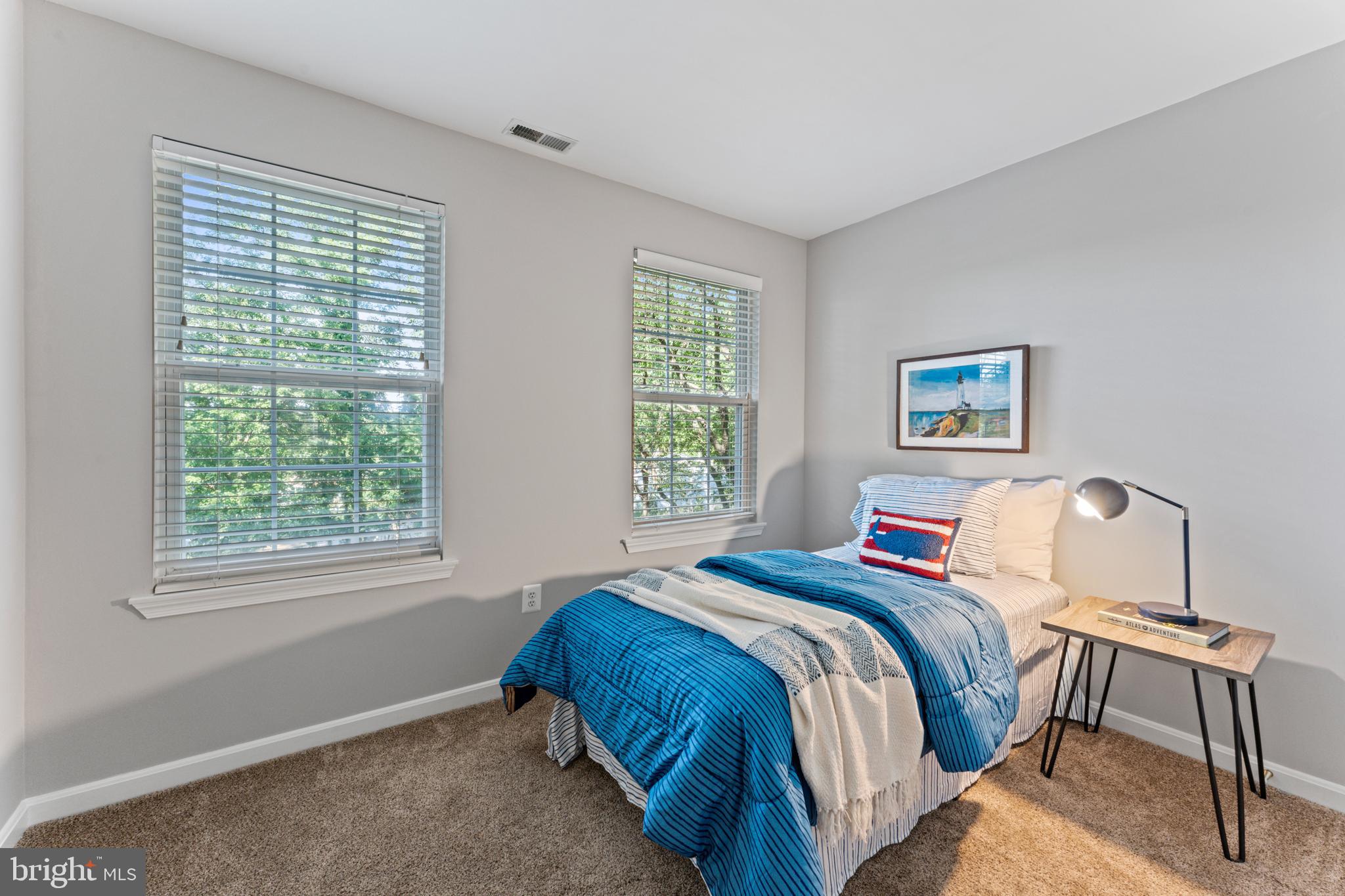 1555 Wall Drive Pasadena, MD 21122 - Photo 26 of 46 a bedroom with a bed and a window