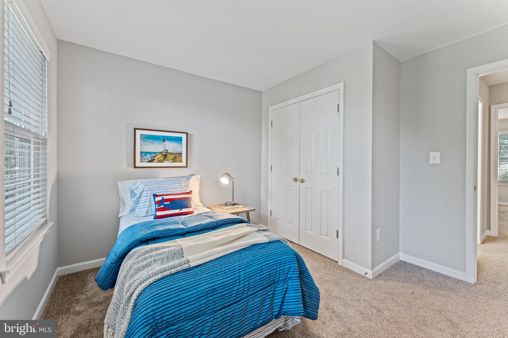 1555 Wall Drive Pasadena, MD 21122 - Photo 27 of 46 a bedroom with a bed and painting on the wall