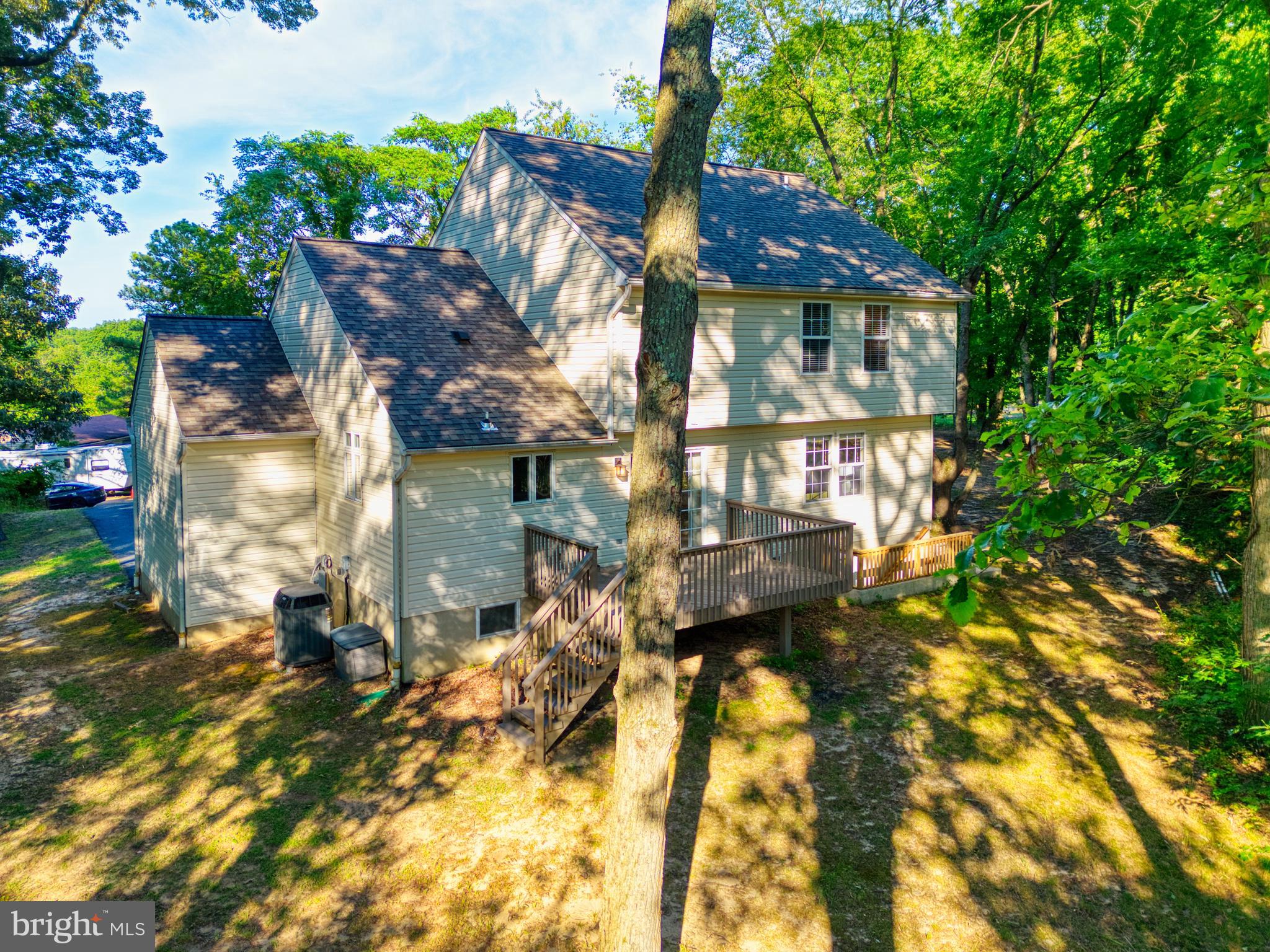 1555 Wall Drive Pasadena, MD 21122 - Photo 37 of 46 a view of a house with a yard