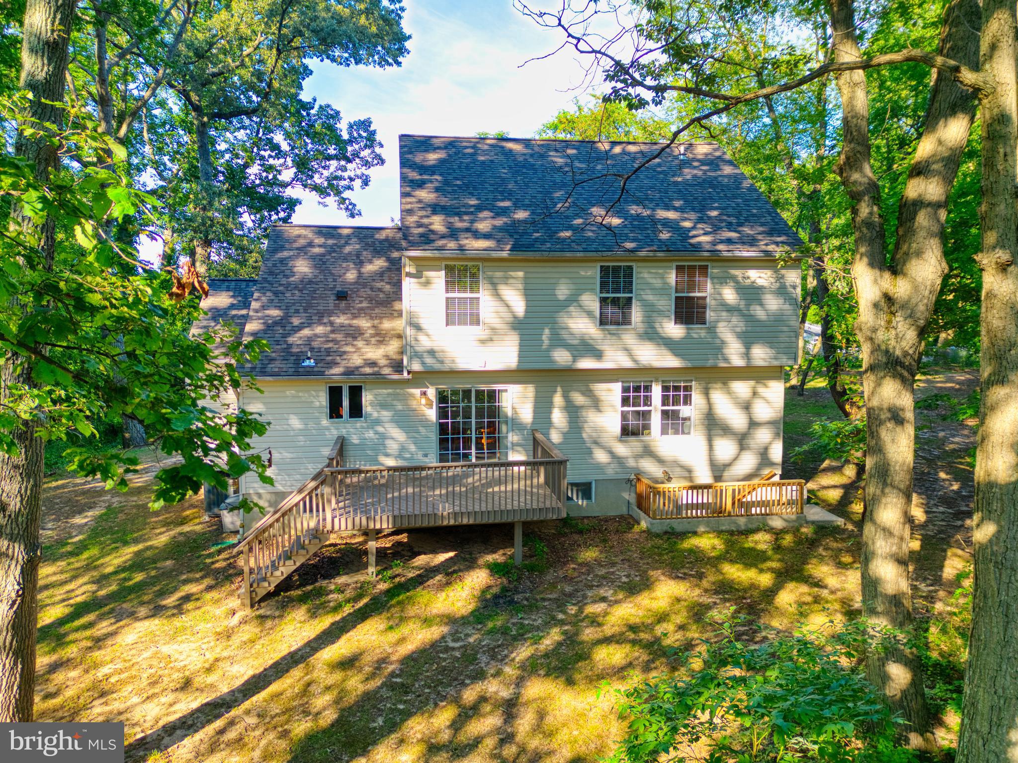1555 Wall Drive Pasadena, MD 21122 - Photo 38 of 46 a front view of a house with a yard