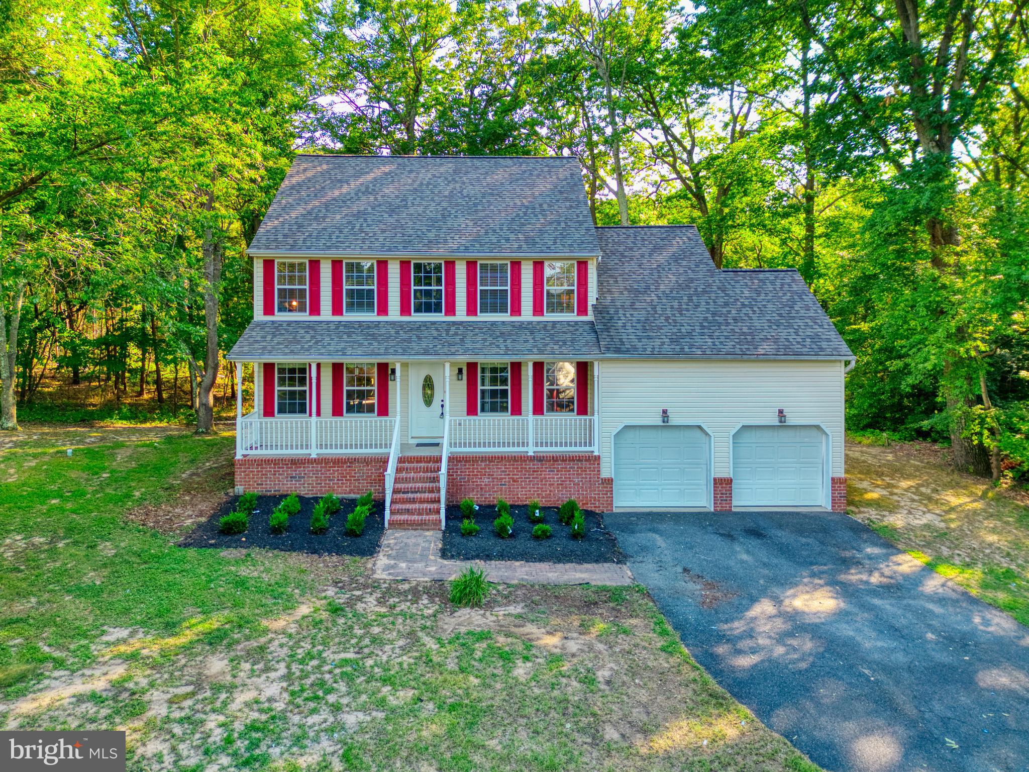 1555 Wall Drive Pasadena, MD 21122 - Photo 39 of 46 a aerial view of a house next to a yard and large trees