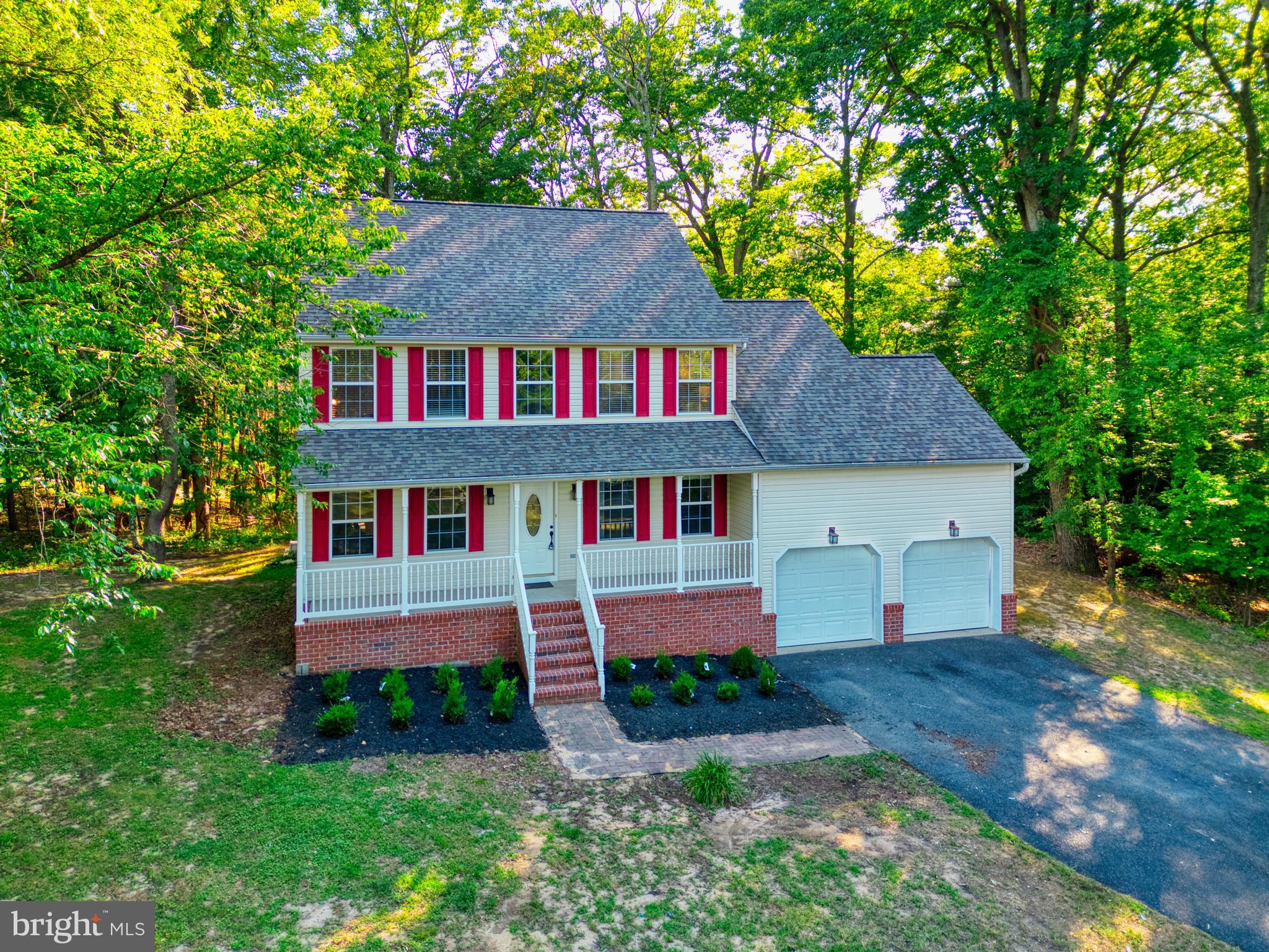 1555 Wall Drive Pasadena, MD 21122 - Photo 40 of 46 a front view of a house with garden