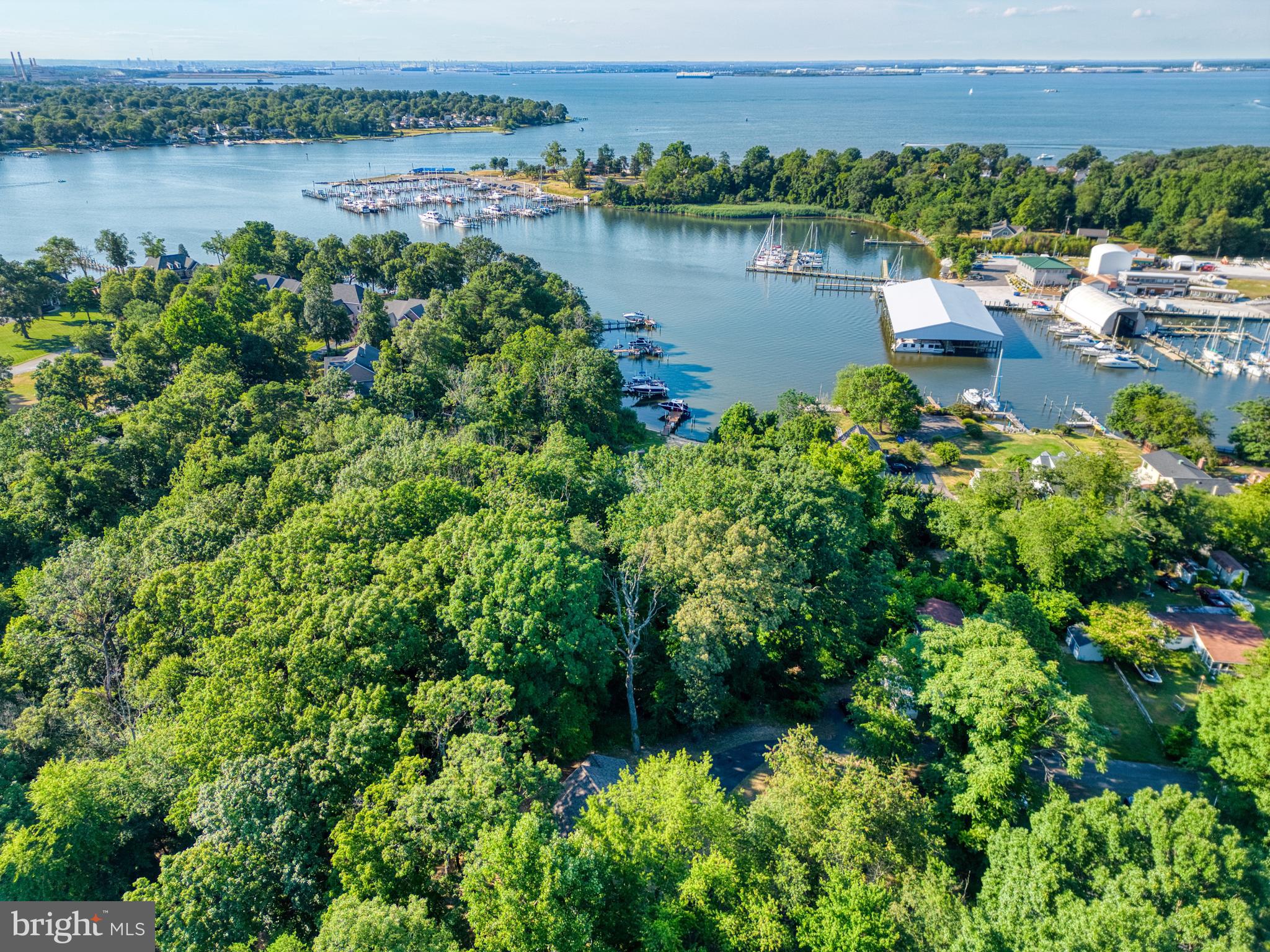 1555 Wall Drive Pasadena, MD 21122 - Photo 42 of 46 a view of a lake with houses in outdoor space
