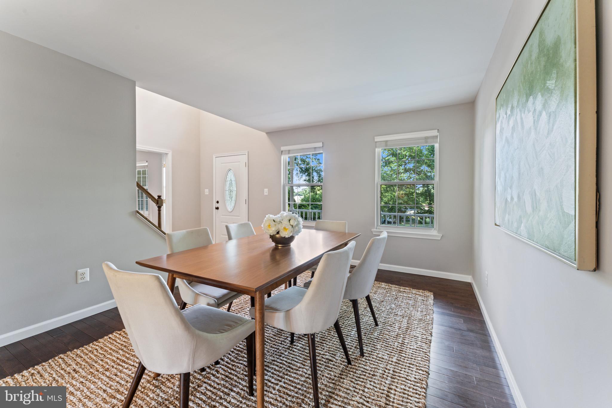 1555 Wall Drive Pasadena, MD 21122 - Photo 8 of 46 a view of a dining room with furniture and wooden floor
