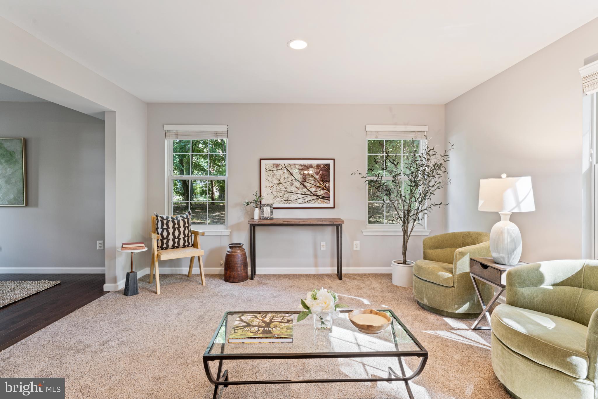1555 Wall Drive Pasadena, MD 21122 - Photo 10 of 46 a living room with furniture a rug and a table