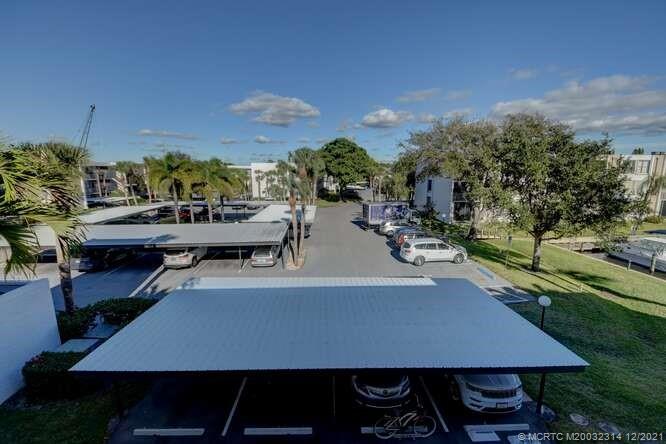 1950 Southwest Palm City Road, Unit 13303 Stuart, FL 34994 - Photo 33 of 34 Assigned covered parking.