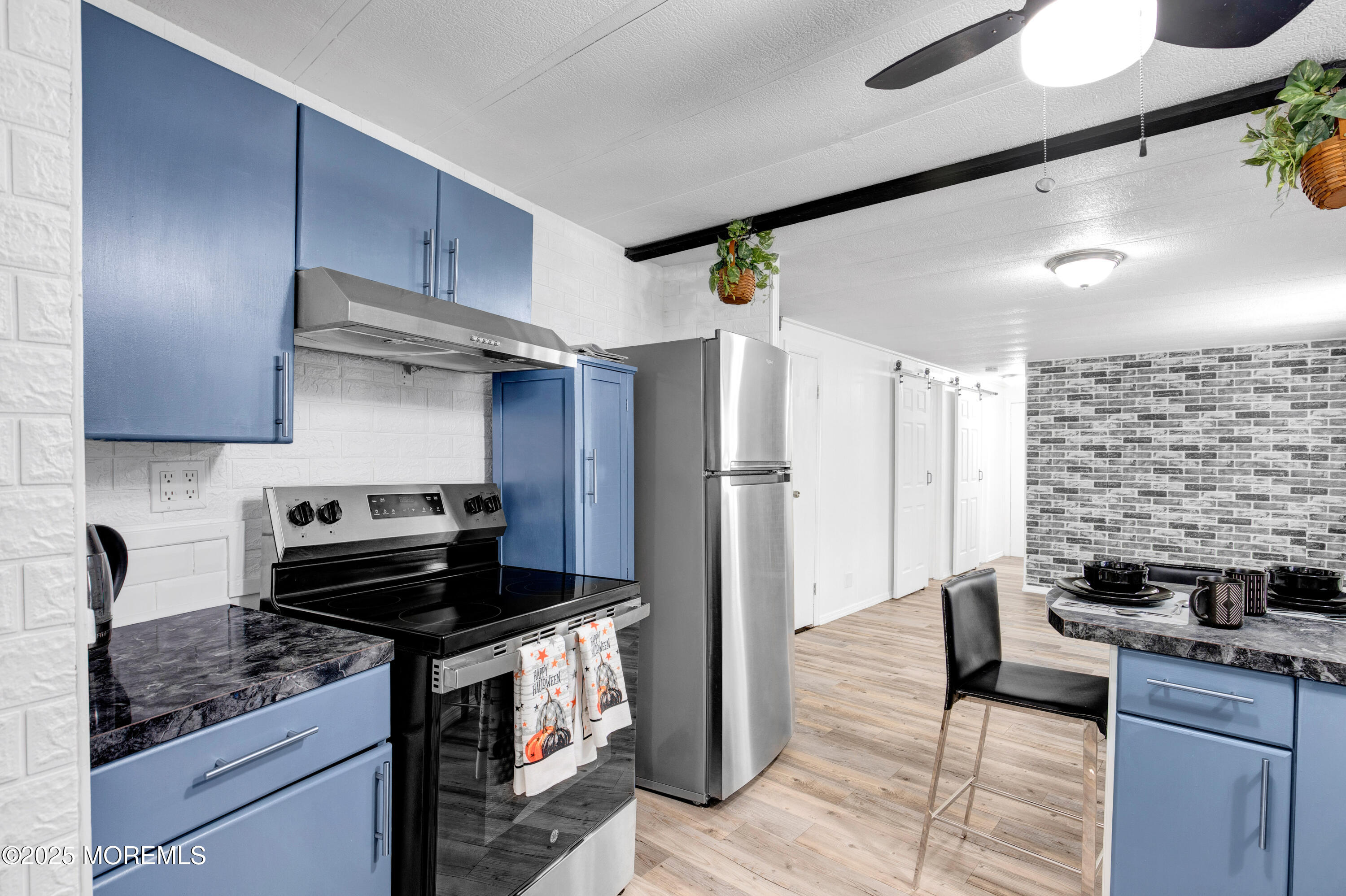 209 Mockingbird Way Whiting, NJ 08759 - Photo 12 of 26 a kitchen with a stove and a refrigerator