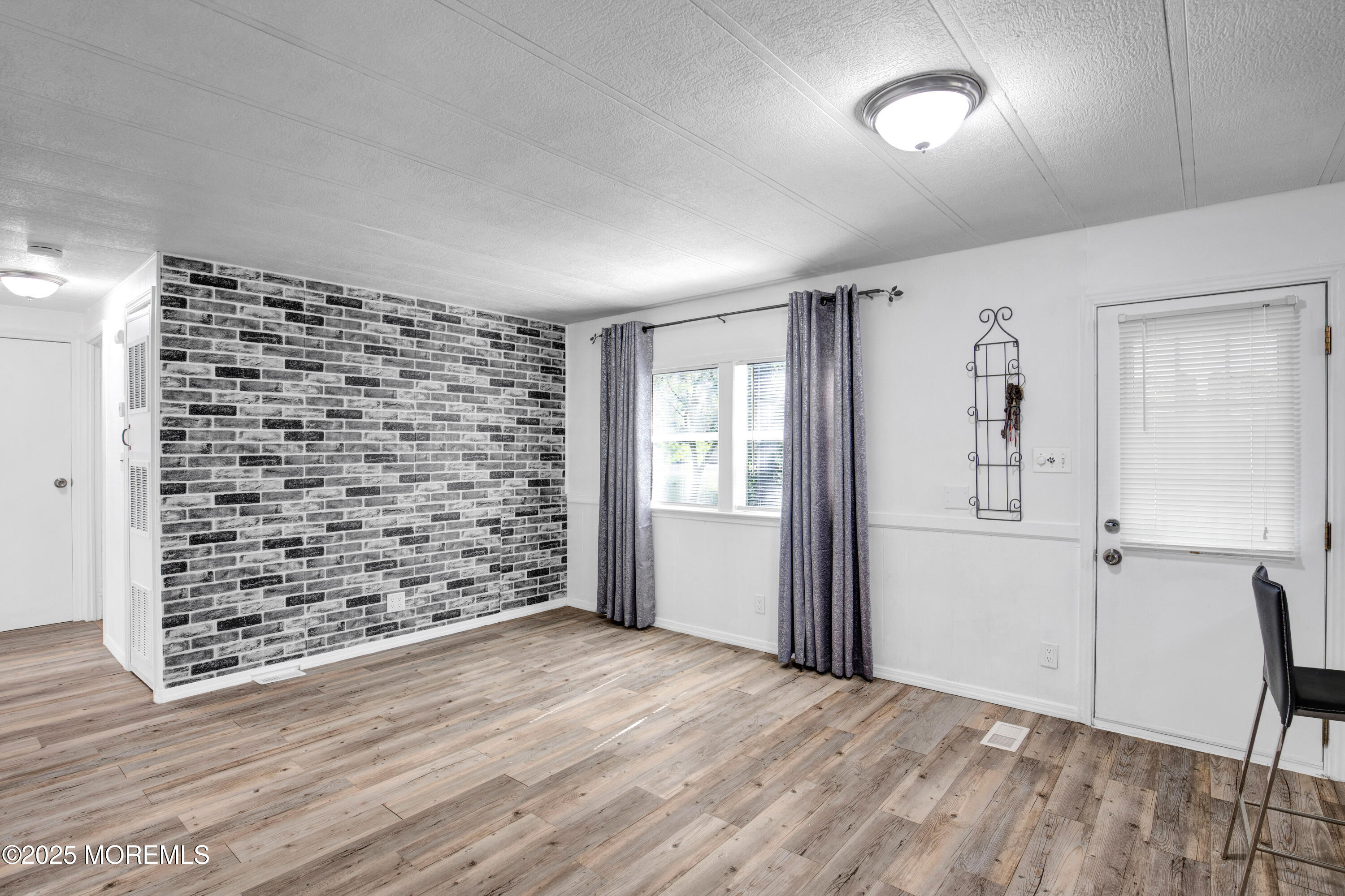 209 Mockingbird Way Whiting, NJ 08759 - Photo 13 of 26 wooden floor in an empty room