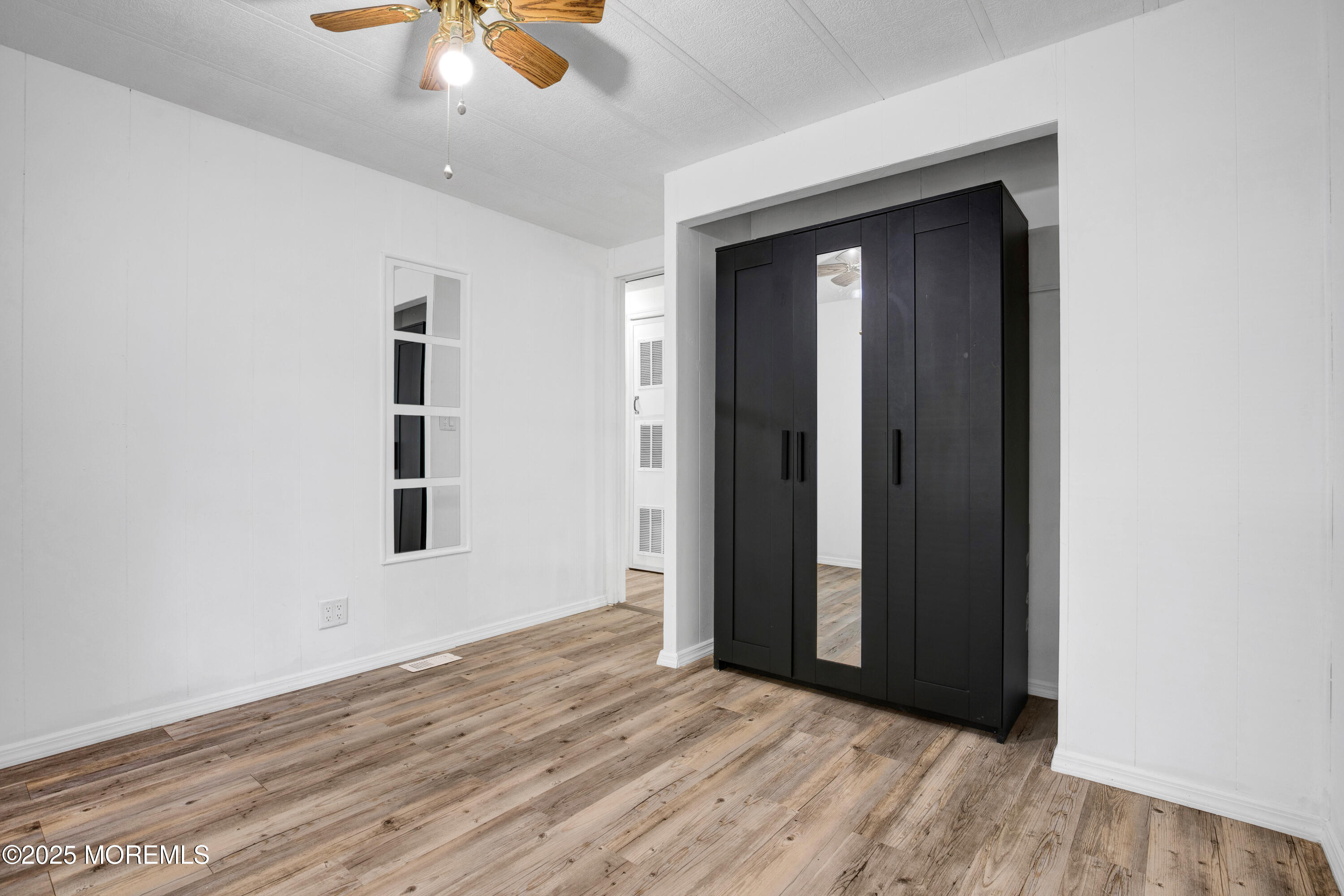 209 Mockingbird Way Whiting, NJ 08759 - Photo 16 of 26 an empty room with closet and windows